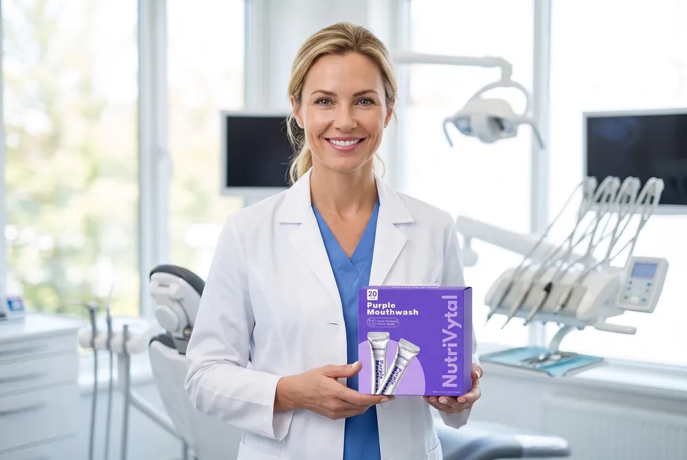 Cosmetic dentist holding NutriVytal Purple Mouthwash